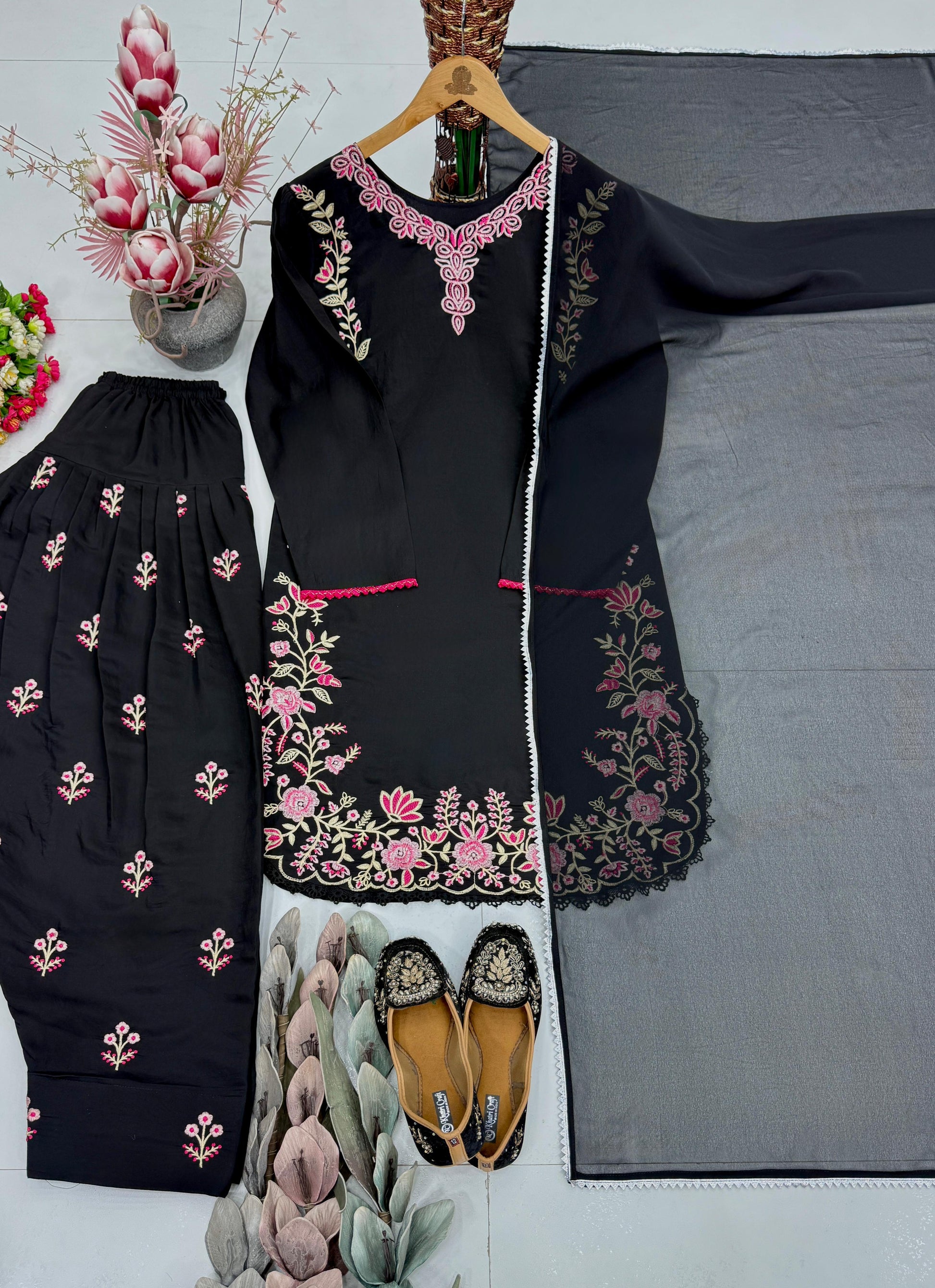 High resolution view of a black faux georgette dupatta scarf displaying a matching four side fancy lace border on a solid canvas.