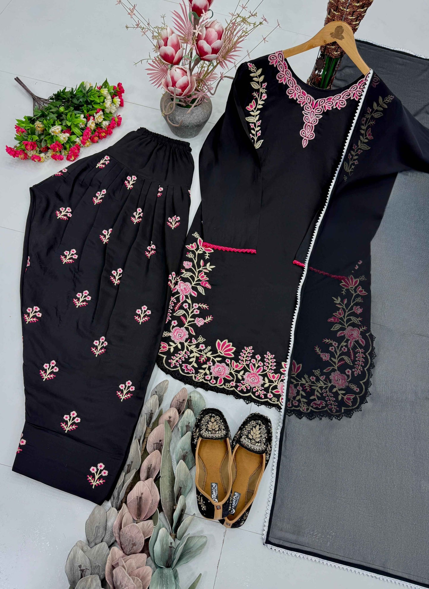 Side perspective of the fully stitched black ethnic dress highlighting the clean tailored seams and a fluid faux georgette dupatta drape.