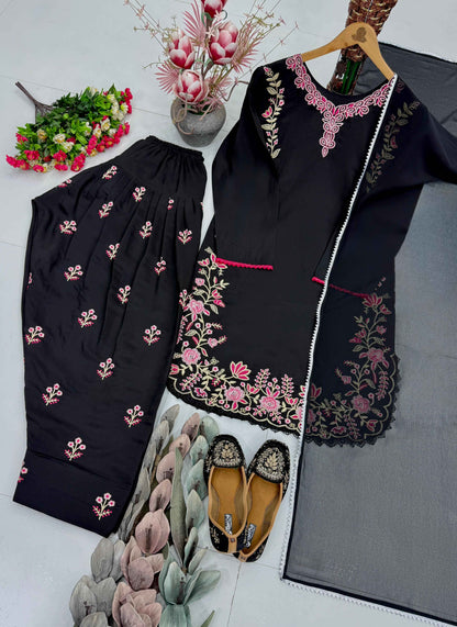Side perspective of the fully stitched black ethnic dress highlighting the clean tailored seams and a fluid faux georgette dupatta drape.