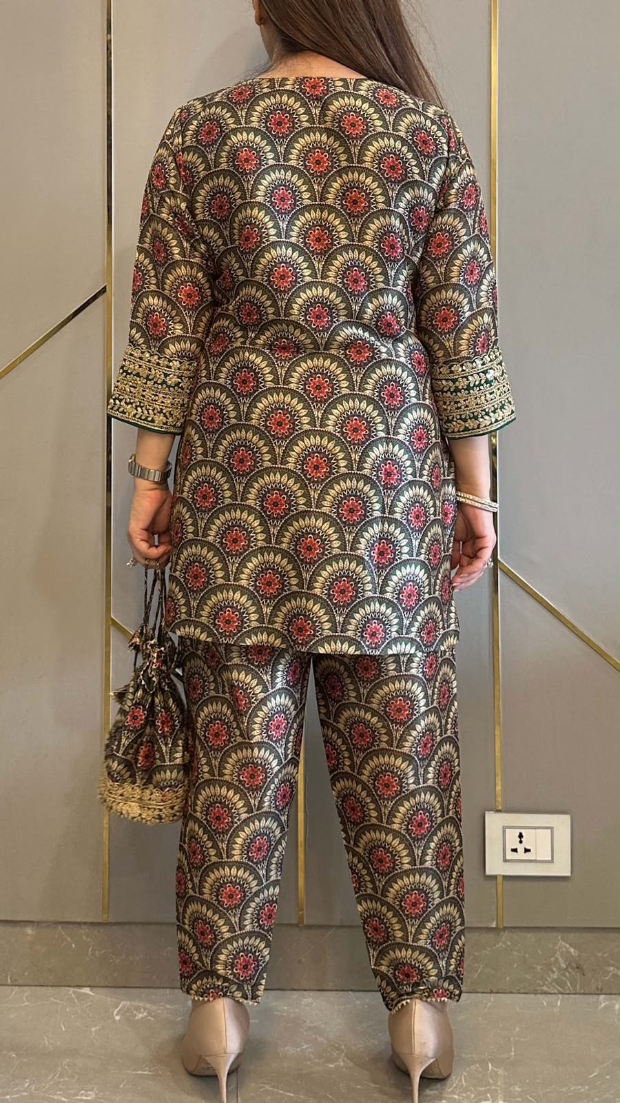 Complete flat layout presentation of the maroon designer co ord set displaying the separate printed top trousers and matching batwa bag together.