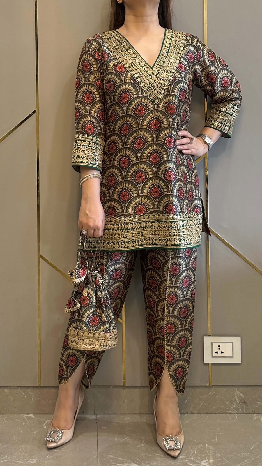 Focused view of the comfortable stretchable elastic belt waist area of the maroon trousers designed to accommodate up to size forty two.