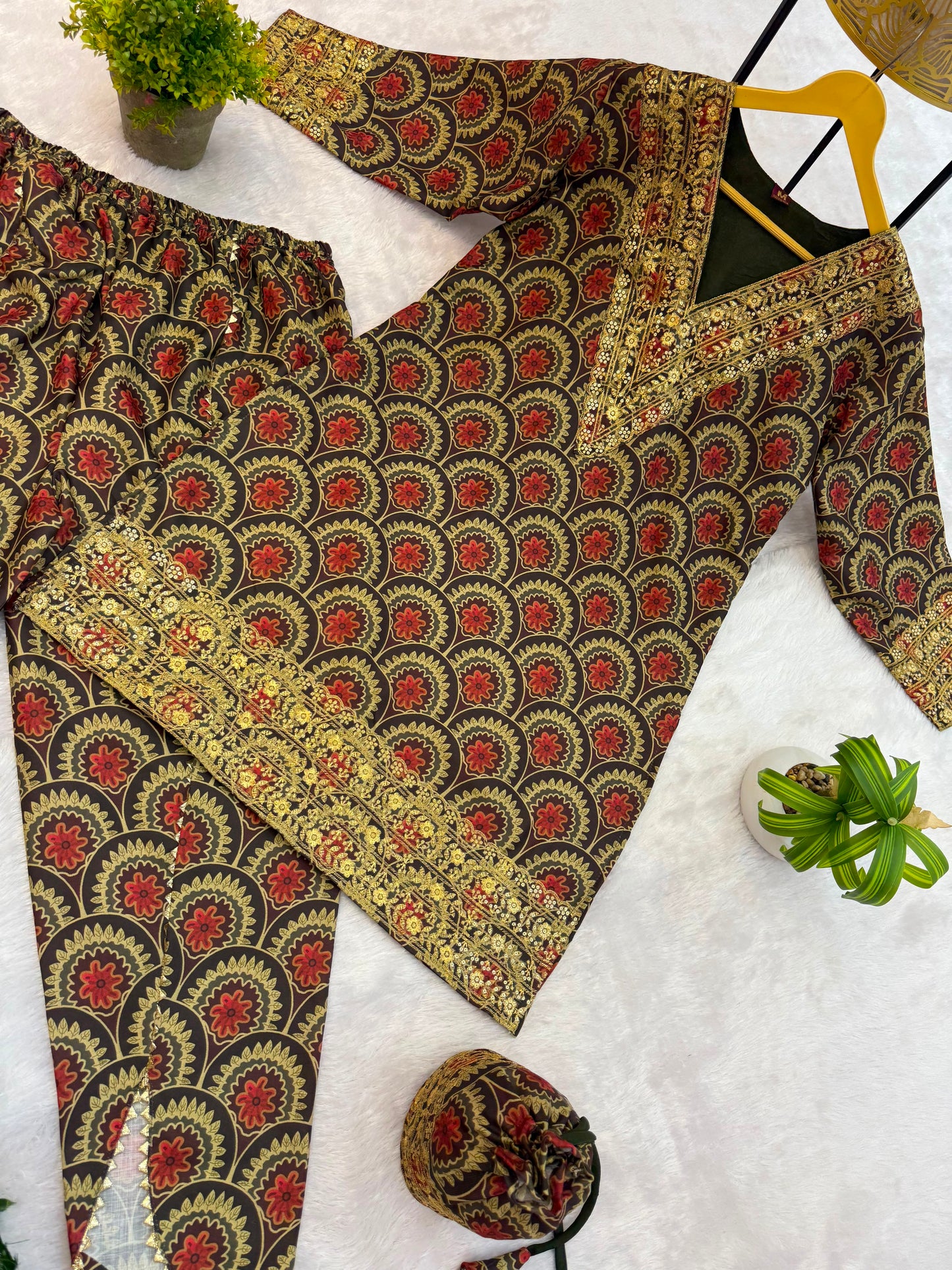 Side perspective of the fully stitched maroon ethnic co ord outfit highlighting the comfortable eighteen inch sleeves and relaxed overall silhouette fit.