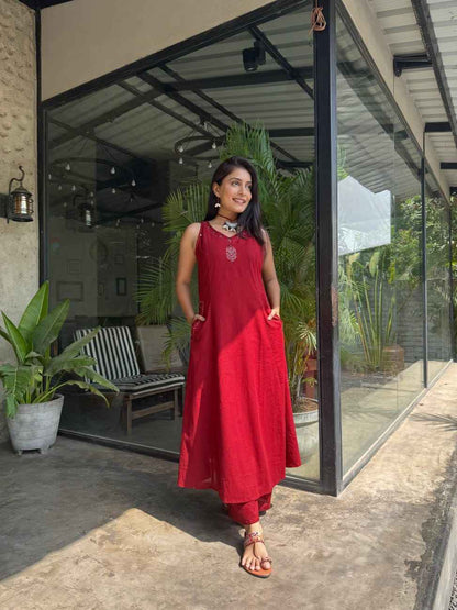 Maroon Image 1 Alt Text: Front view of full two piece maroon cotton slub embroidered kurta set showcaingg amatching strai floral embroidered tunic top and ght palazzo pants.