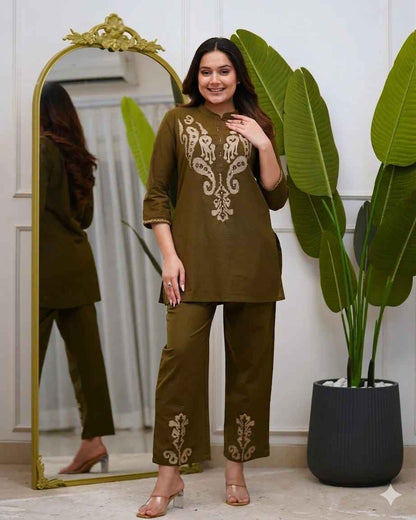  Front view of full two piece olive green pure cotton embroidered co ord set displaying a short tunic top and matching straight casual trousers.