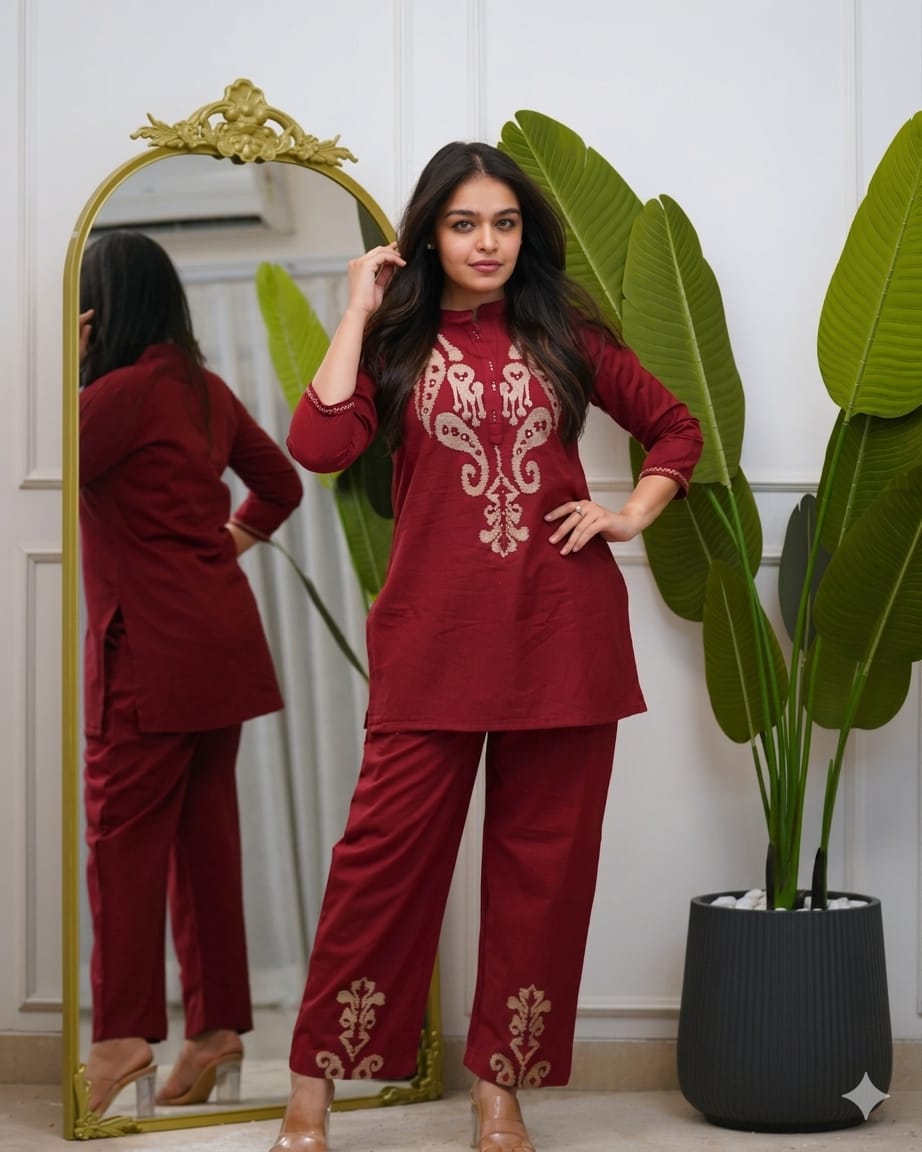 Front view of full two piece maroon pure cotton embroidered co ord set displaying a short tunic top and matching straight casual trousers.