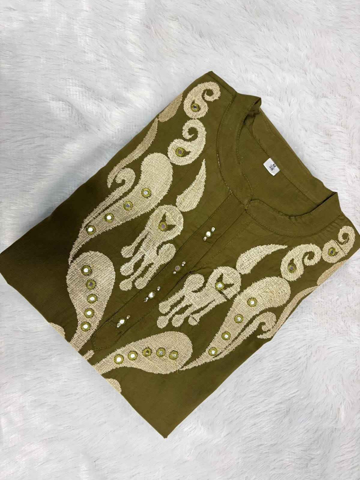 Side perspective of the fully stitched summer special olive green cotton tunic highlighting the comfortable short sleeves and clean tailored seams.