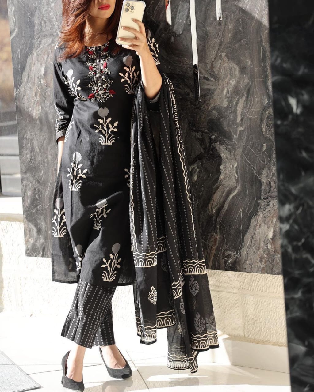 Front view of full three piece black handwork embroidered kurta set displaying a straight fit cotton tunic top trousers and a soft malmal dupatta scarf.