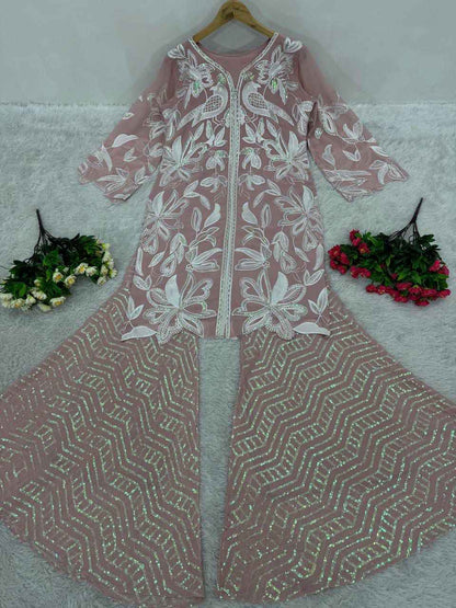 High resolution view of the dusty rose heavy faux georgette palazzo trousers displaying the full heavy embroidered sequences work from waist to hem.