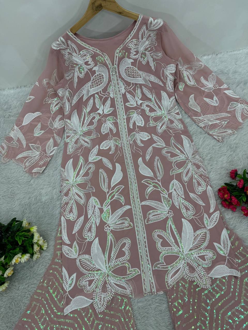 Detailed view of the side profile showcasing the high quality heavy zip fitting attachment on the fully stitched dusty rose tunic top.