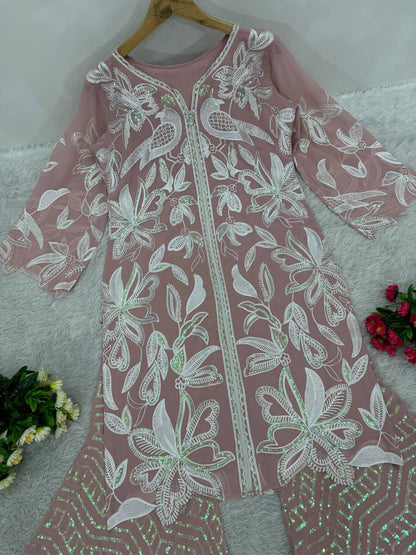 Detailed view of the side profile showcasing the high quality heavy zip fitting attachment on the fully stitched dusty rose tunic top.