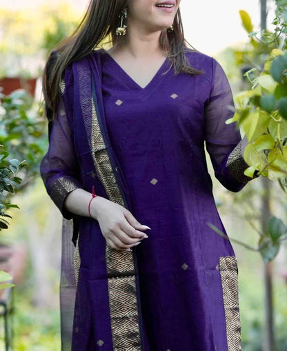 Close up view of authentic handwoven jamdani design motifs and intricate geometric loom patterns on a rich royal purple cotton fabric surface.