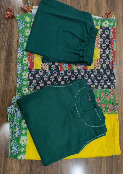Detailed view of the green kurta back profile showcasing the classic elegant button closure placement on the high neck boundary.