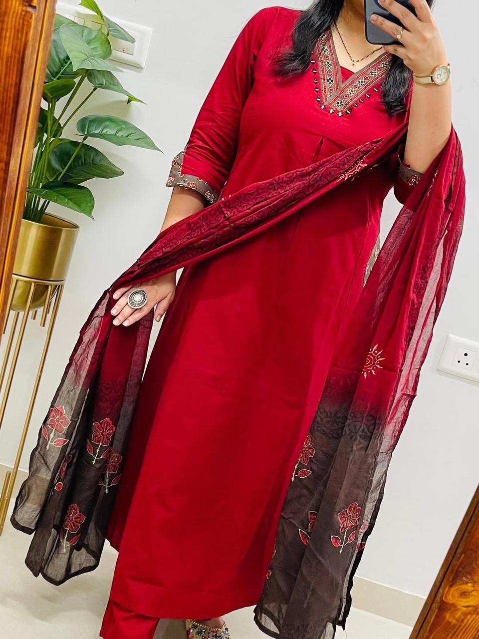 Back angle presentation of the red casual cotton kurta showing the uniform self printing lines and a smooth seamless fabric structure.