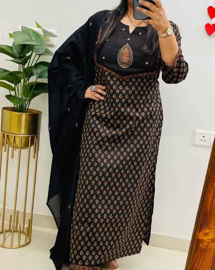 Front view of full three piece black fine cotton embroidery kurti set displaying an embroidered heavy cotton tunic straight pants and printed dupatta.