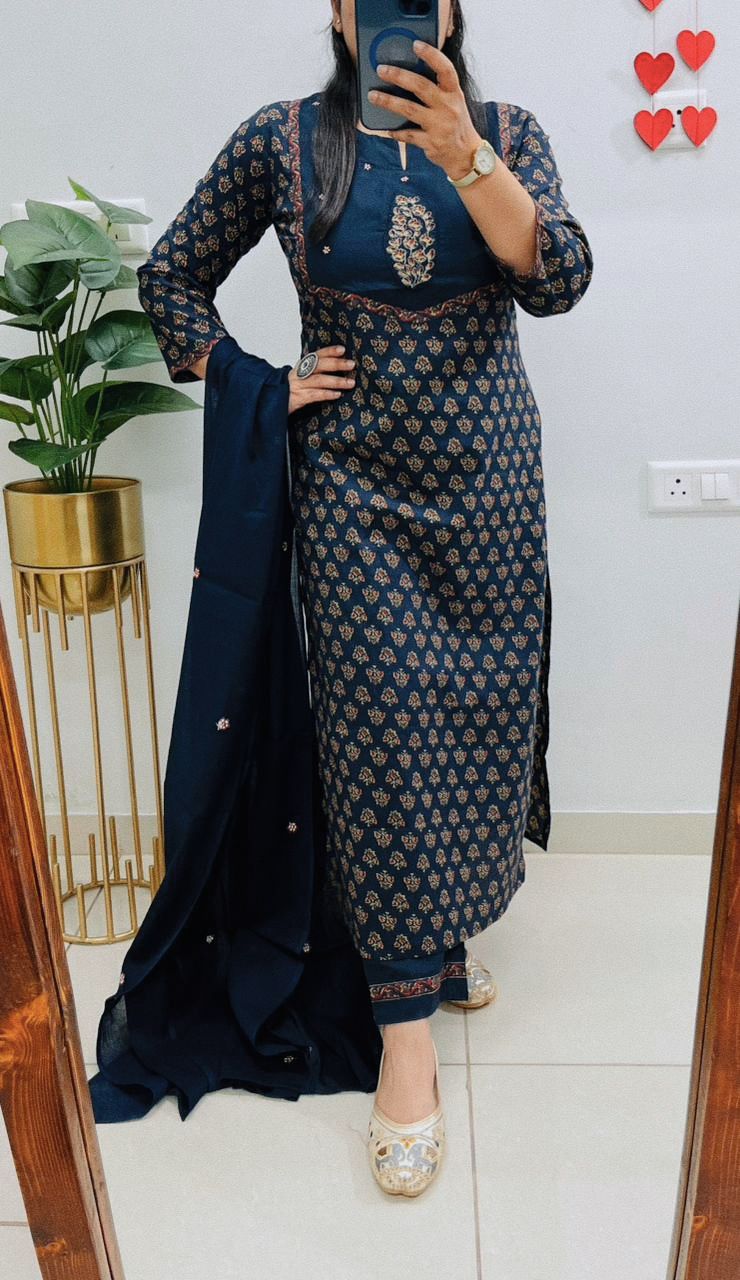 Front view of full three piece navy blue fine cotton embroidery kurti set displaying an embroidered heavy cotton tunic straight pants and printed dupatta.
