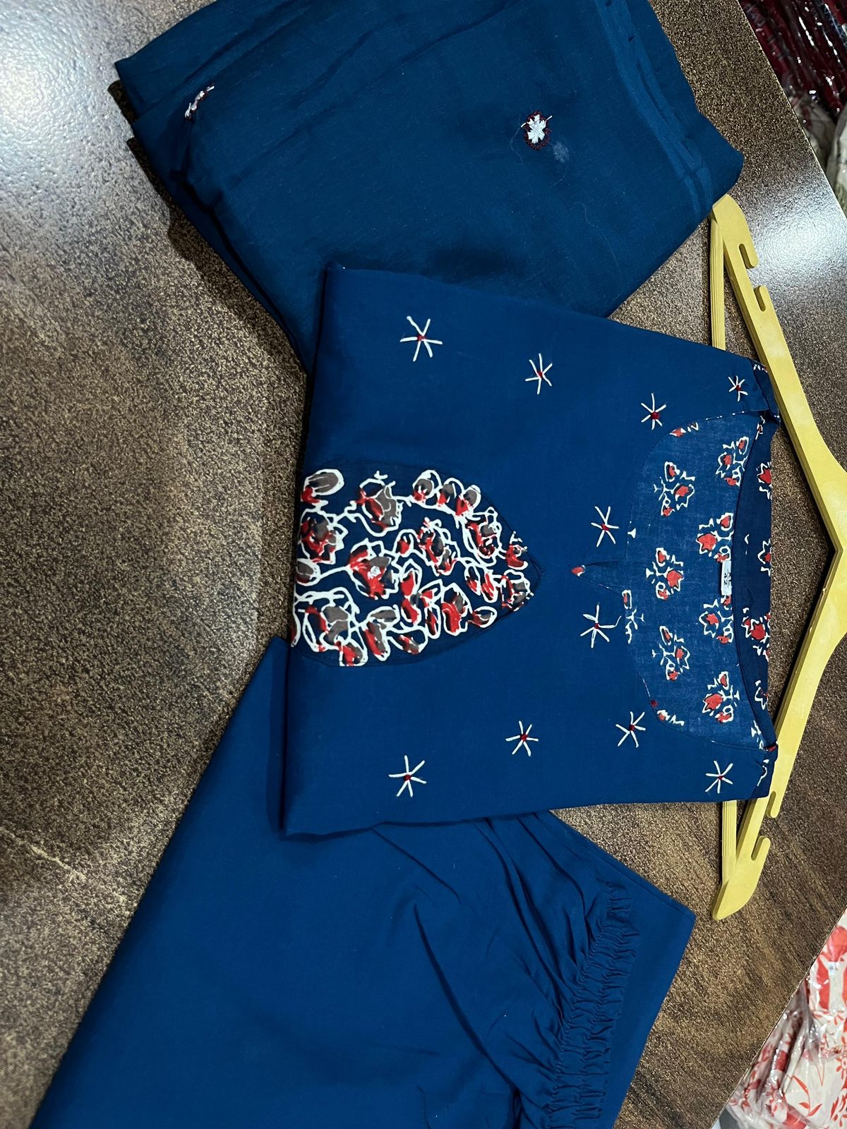 Side perspective presentation of the fully stitched navy blue ethnic top highlighting the clean tailored seams and standard regular straight fit outline.