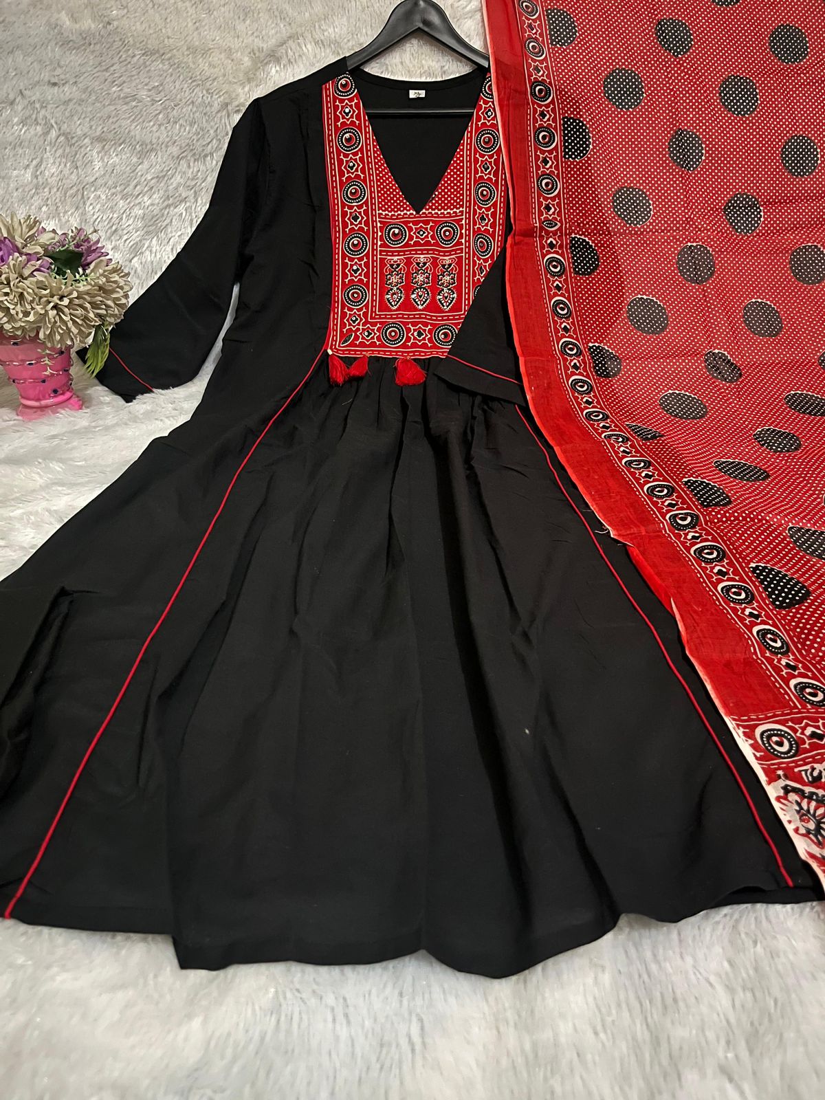 Side perspective presentation of the fully stitched black ethnic top highlighting the clean tailored seams and standard regular straight fit outline.