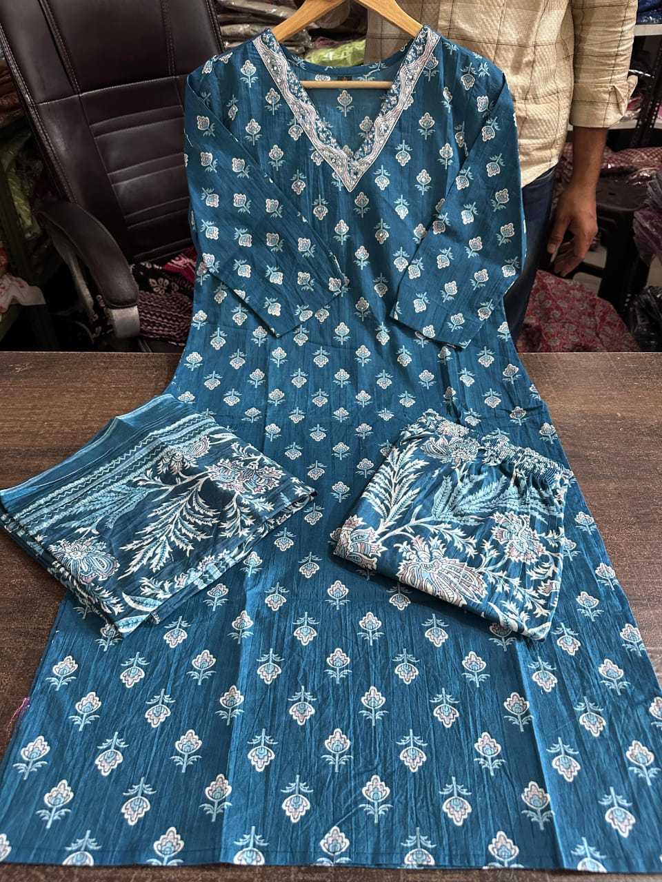 Side perspective presentation of the fully stitched blue ethnic top highlighting the clean tailored seams and standard regular straight fit outline.