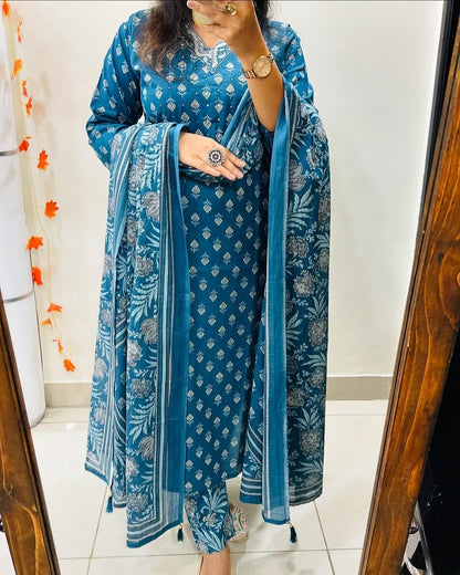 Front view of full three piece blue heavy cotton embroidery kurt set displaying an embroidered tunic top straight trousers and printed dupatta.