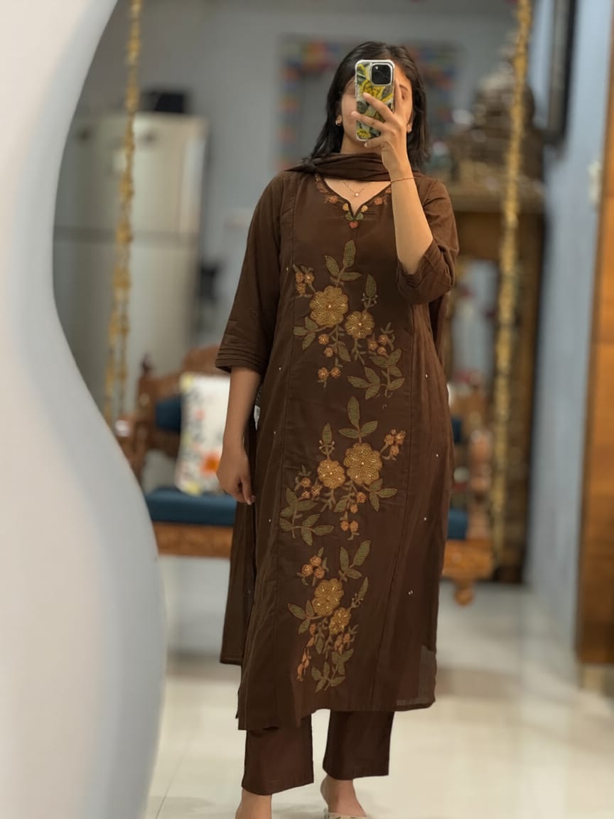 Front view of full three piece klosia brown kalamkari fusion suit set displaying an embroidered heavy cotton kurti straight pants and mal cotton dupatta.