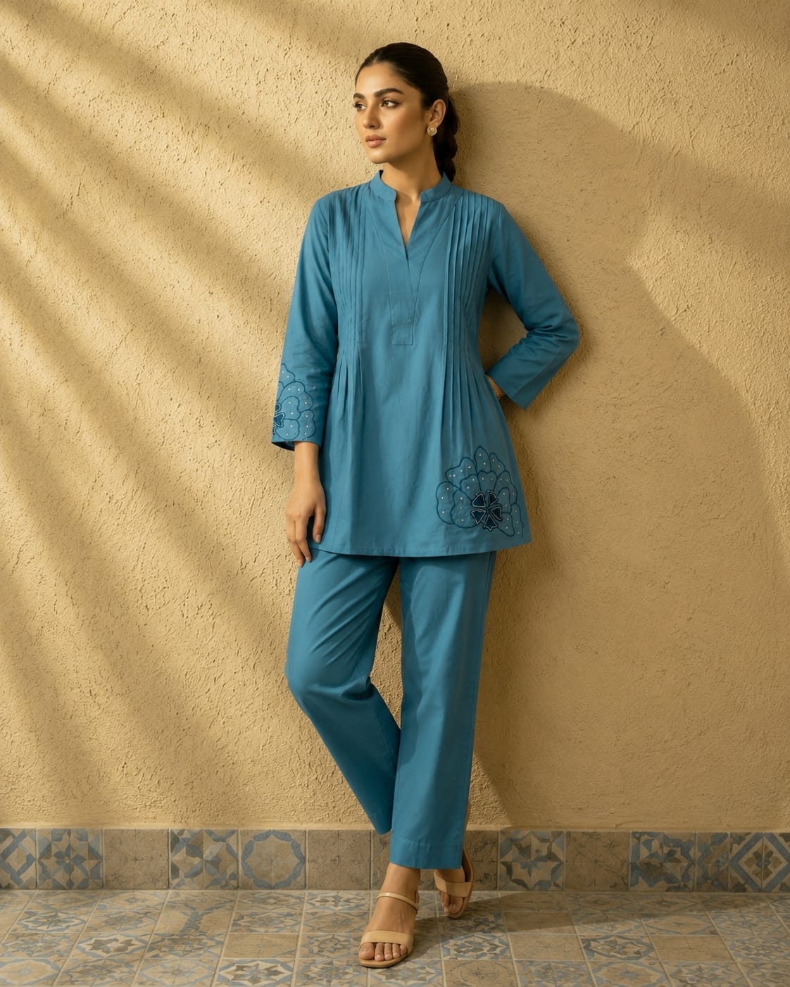 Detailed front view of the tea blue matching palazzo pants showcasing the comfortable waist area and wide leg flared hem line.