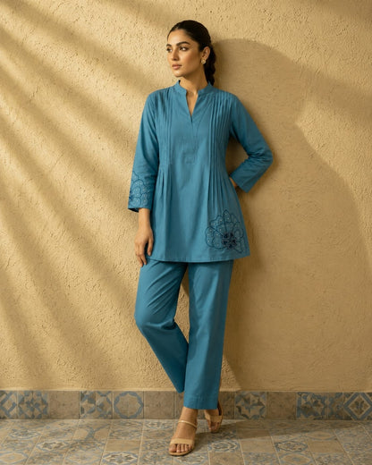 Detailed front view of the tea blue matching palazzo pants showcasing the comfortable waist area and wide leg flared hem line.