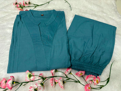 Side perspective presentation of the fully stitched tea blue casual tunic highlighting the clean tailored seams and relaxed regular fit line.
