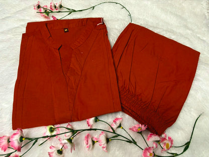 Detailed front view of the rust orange matching palazzo pants showcasing the comfortable waist area and wide leg flared hem line.