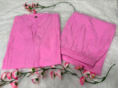 Close up view of detailed traditional embroidery work and high quality thread work patterns on a soft pink cotton fabric bodice canvas.