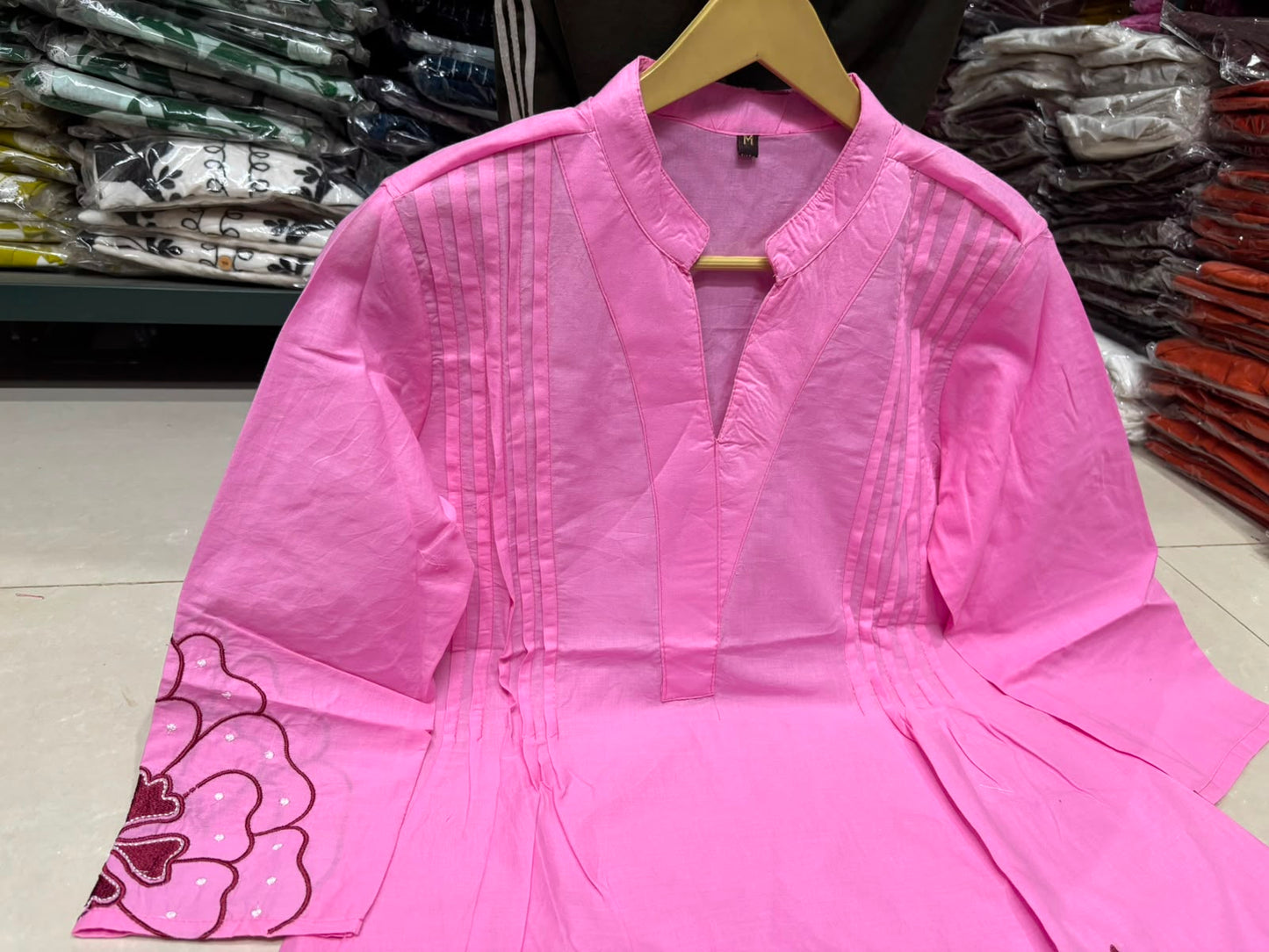 Detailed front view of the pink matching palazzo pants showcasing the comfortable waist area and wide leg flared hem line.
