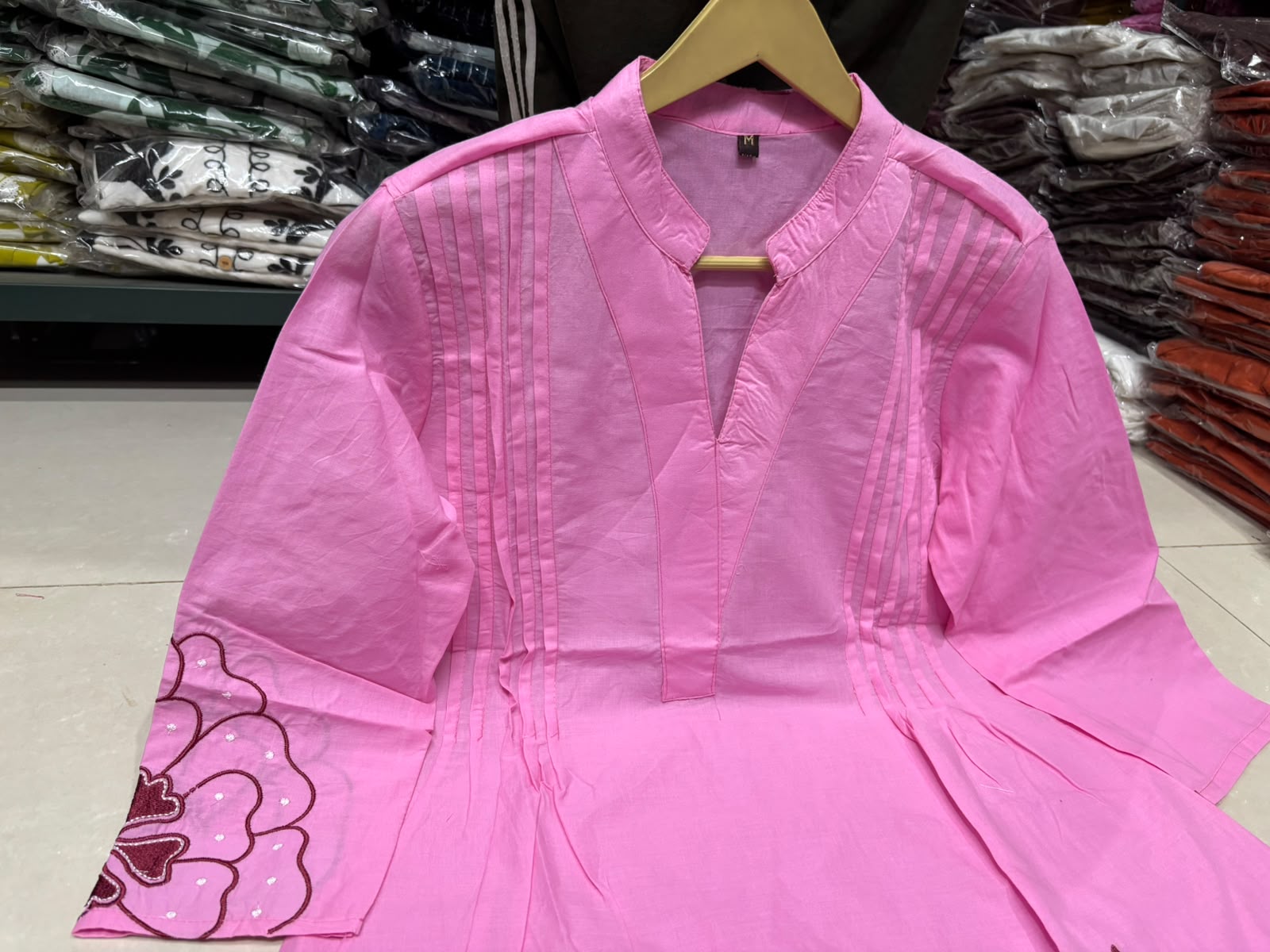 Detailed front view of the pink matching palazzo pants showcasing the comfortable waist area and wide leg flared hem line.