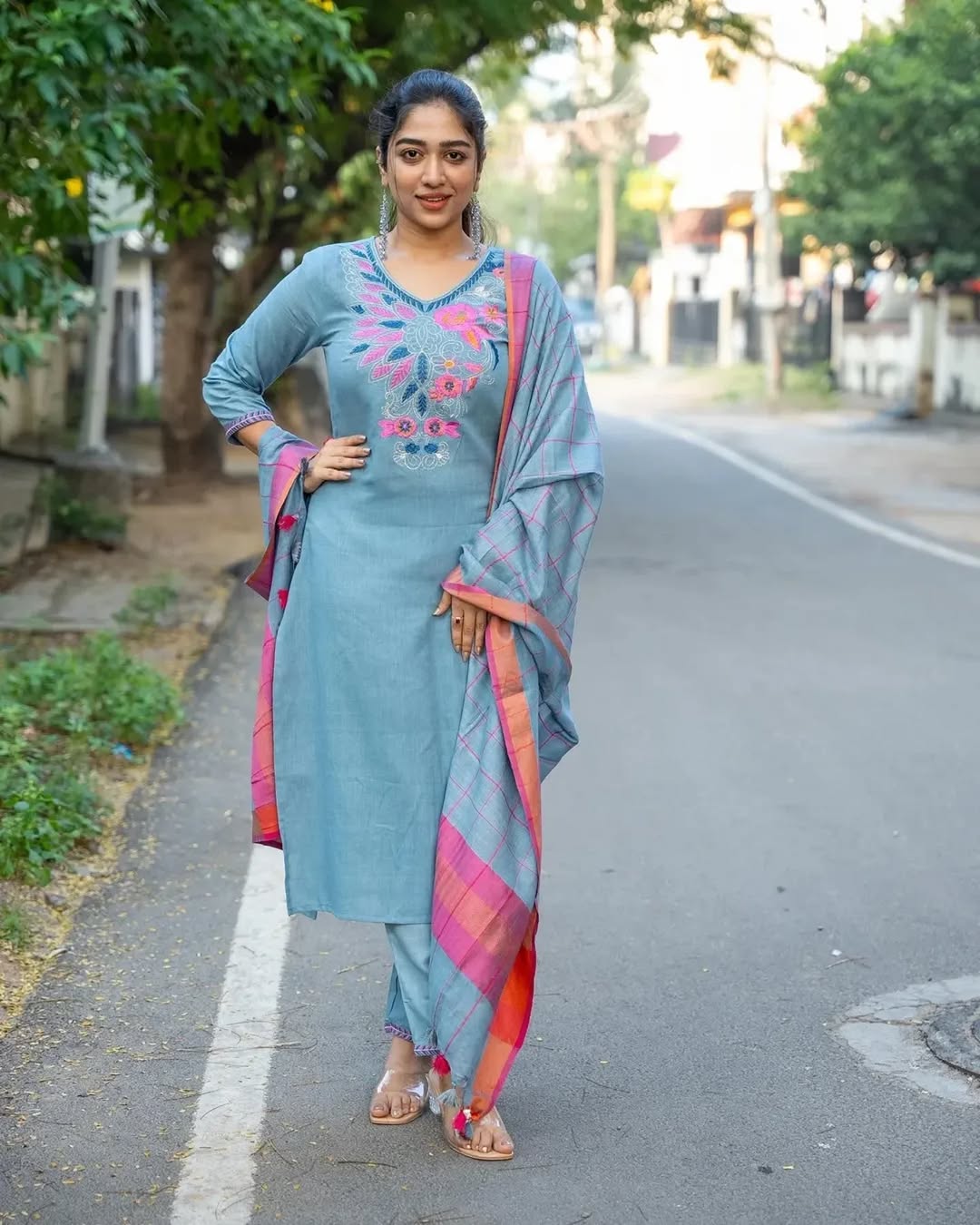 Front view of full three piece sky blue classy handloom straight line kurti set displaying a v neck tunic top structured pants and weaved linen dupatta.