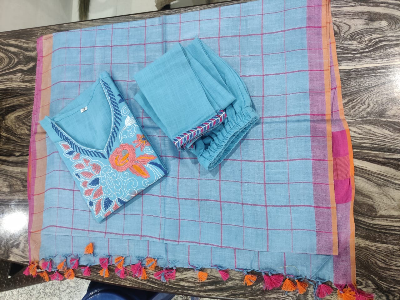 High resolution view of the premium sky blue pure linen full size weaved dupatta scarf highlighting the intricate texture lines and lightweight drape.