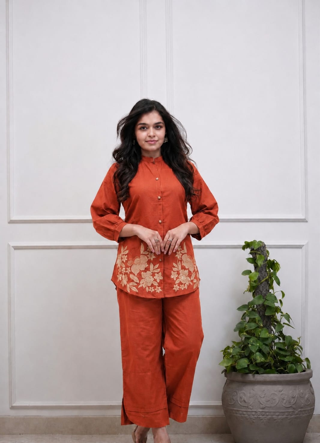 Detailed front view of the rust orange matching trousers showcasing the comfortable waist area and straight leg opening tailoring.