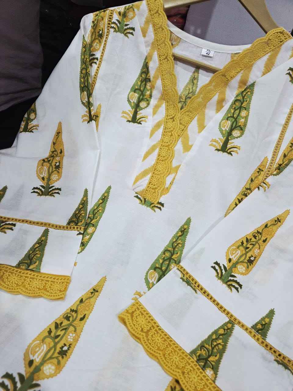 Full length layout of the lemon green mul cotton dupatta scarf showing the beautifully decorated borders and lightweight breathable weave.