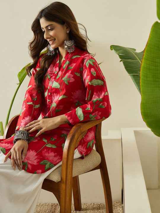Front view of full two piece red breathable kurta farshi salwar set displaying a printed short tunic and flared trousers.