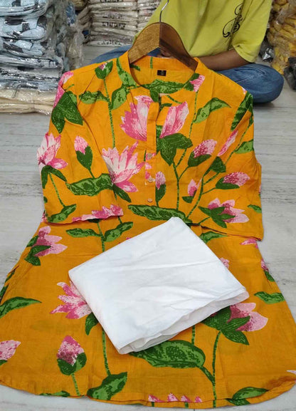Close up view of detailed traditional printing patterns on a bright yellow imported cotton fabric bodice canvas.