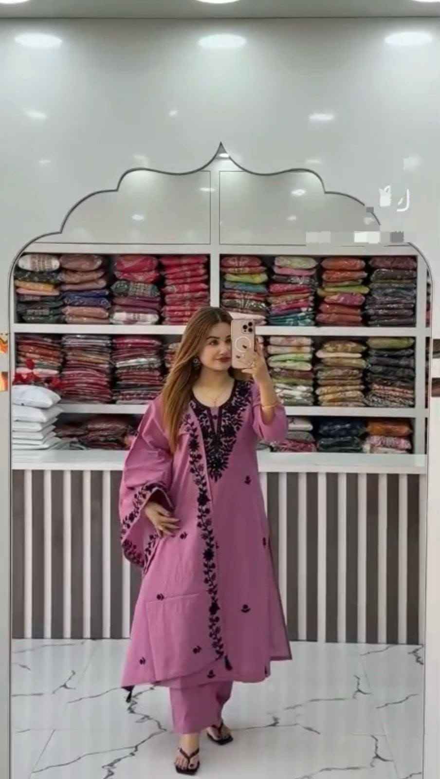 Front view of full three piece purple flared cotton a line kurti set displaying an embroidered top straight pants and heavy dupatta.