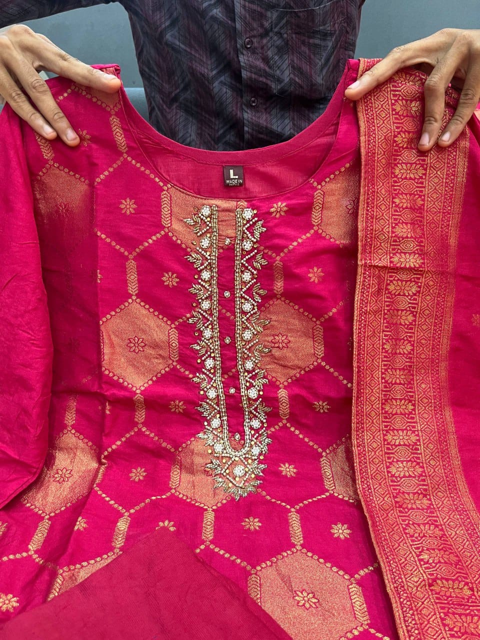 Front close view of the matching dark pink maharaja silk trousers pants showing the luxurious material texture and structured waist area.