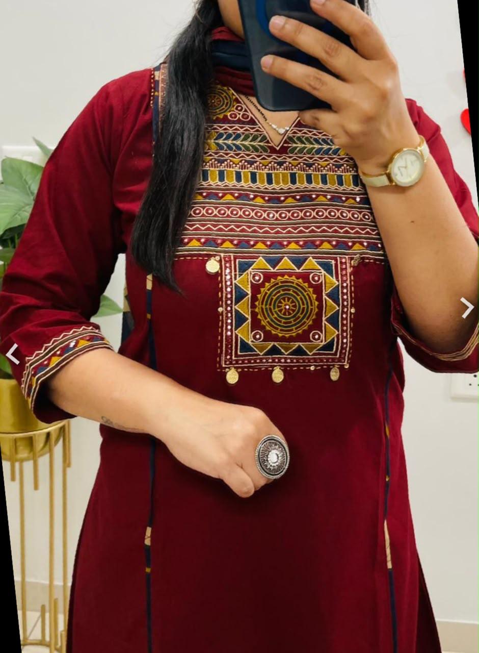 Side perspective presentation of the fully stitched maroon casual ethnic tunic highlighting the clean tailored side seams and straight fit outline.