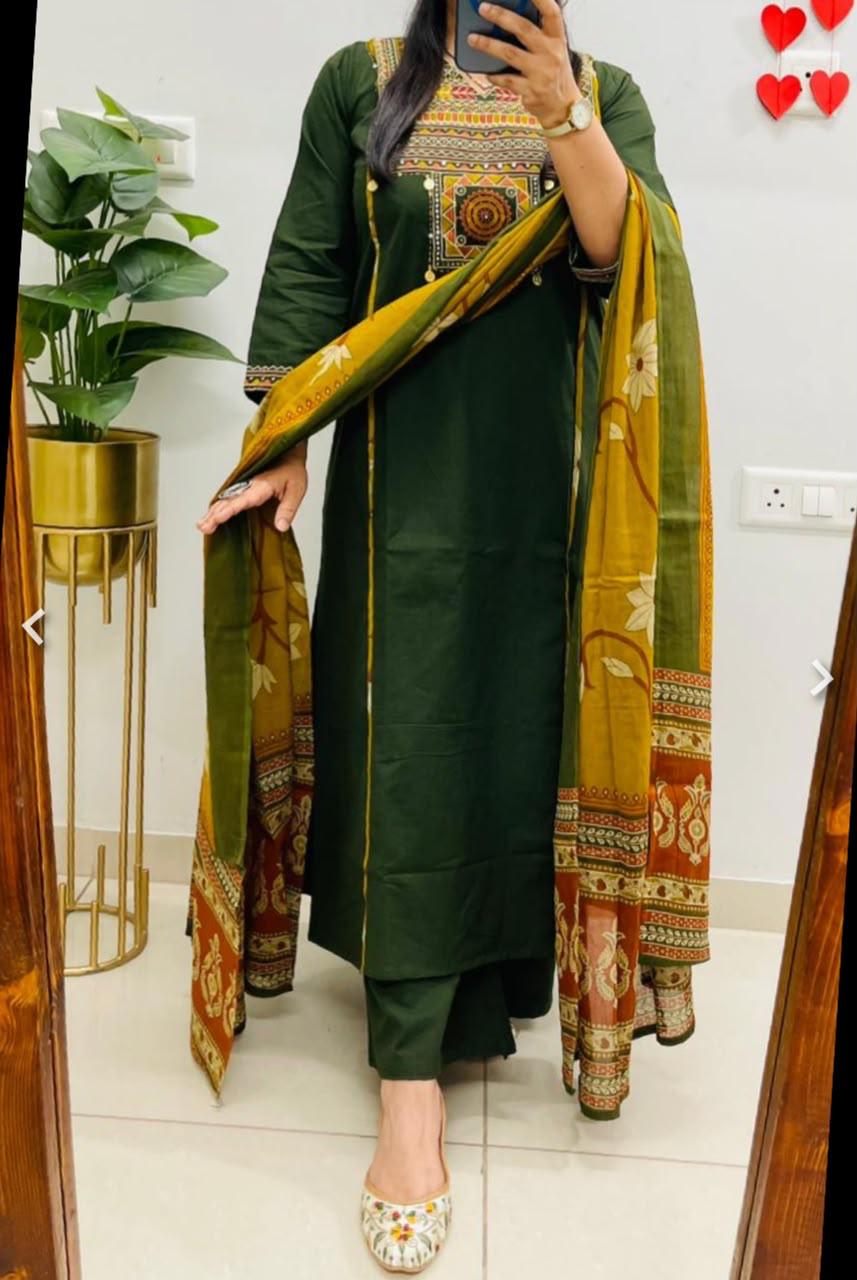 Front view of full three piece green pure cotton embroidery suit set displaying the embroidered yoke top trousers and matching full dupatta.