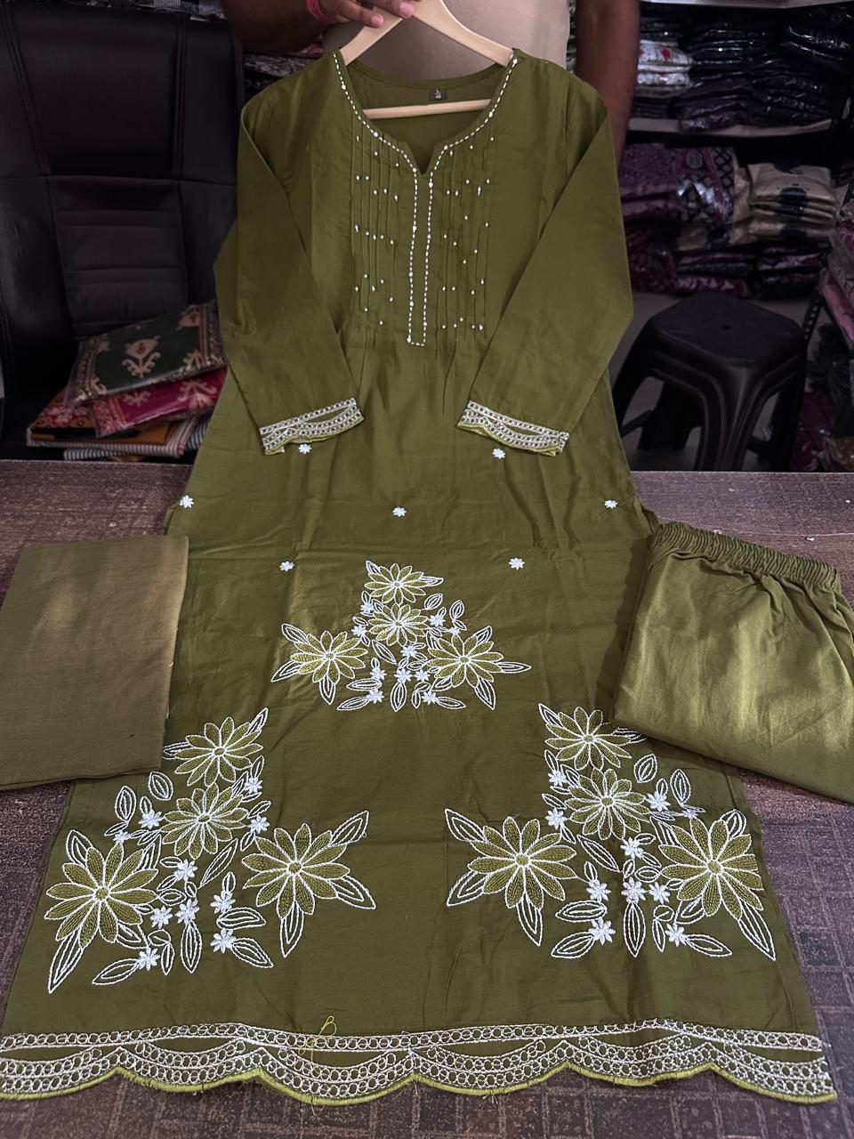 Close up view of detailed traditional embroidery work and high quality thread patterns on a rich olive green heavy cotton fabric bodice canvas - WishTown Fashion Club