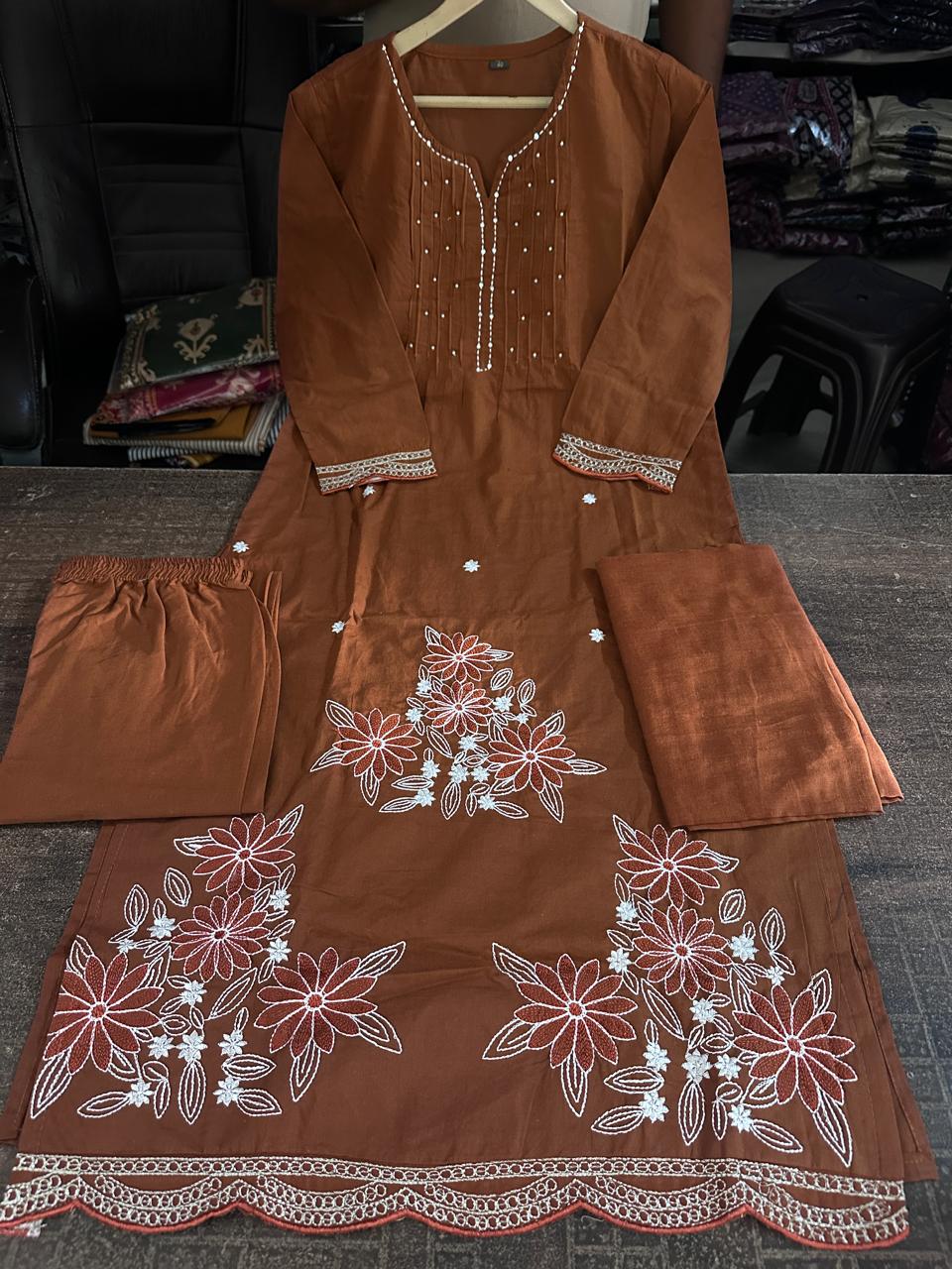 Close up view of detailed traditional embroidery work and high quality thread patterns on a deep coffee brown heavy cotton fabric bodice canvas - WishTown Fashion Club
