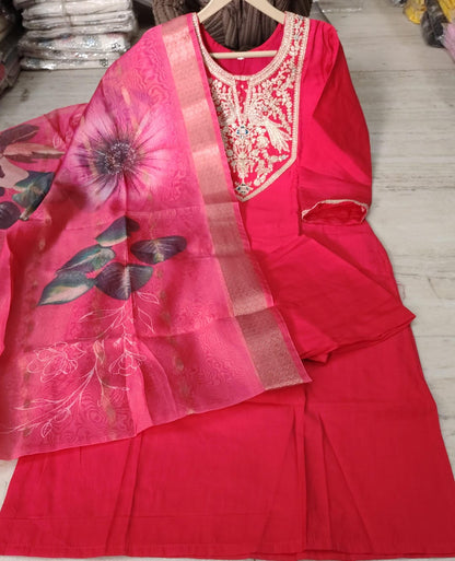 Close up view of intricate heavy embroidery work and fine stitching on a dark pink Roman silk tunic yoke panel - WishTown Fashion Club