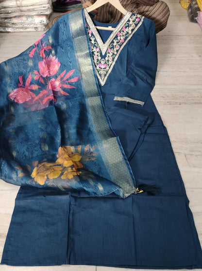 Close up view of intricate heavy embroidery work and fine stitching on a blue Roman silk tunic yoke panel - WishTown Fashion Club