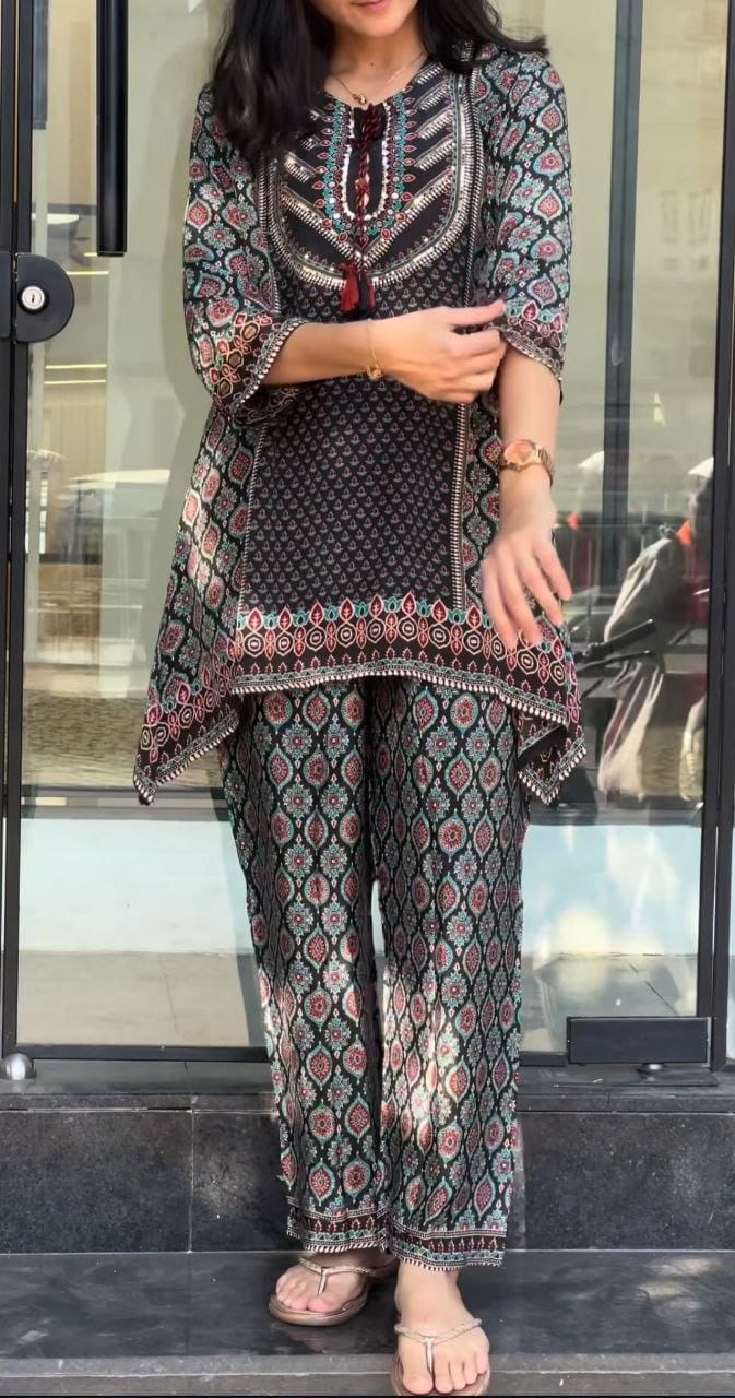 Front view of designer two piece black pure natural crape co ord set showing top and forty inch palazzo pants