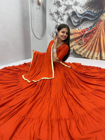 Wide angle view showcasing the massive nine plus meter flair and twirl volume of orange rayon cotton lehenga skirt - WishTown Fashion Club