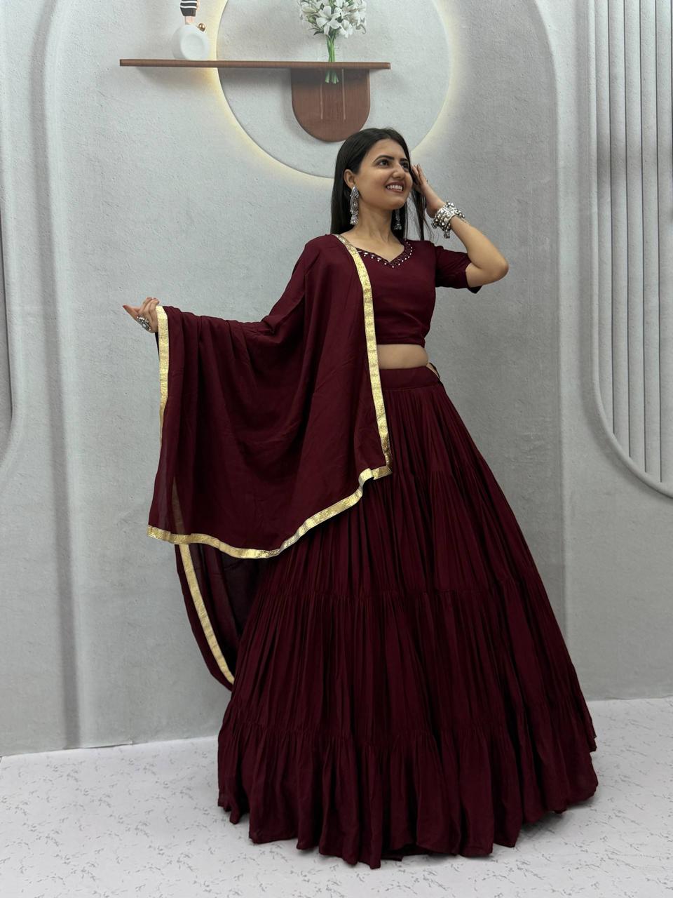 Front view of full three piece maroon rayon cotton handmade mirror work lehenga choli with flared skirt padded blouse and dupatta - WishTown Fashion Club