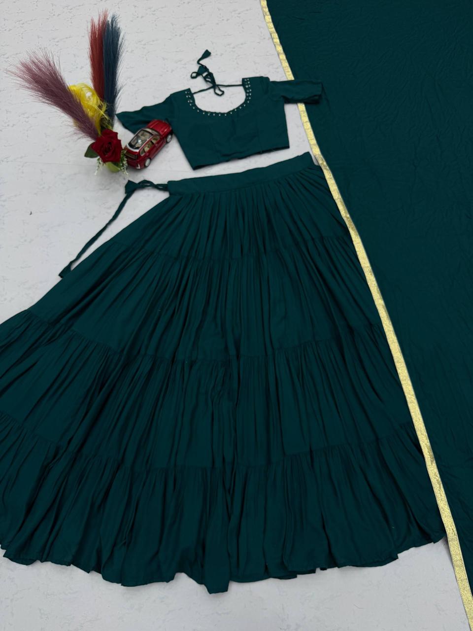 Wide angle view showcasing the massive nine plus meter flair and twirl volume of bottle green rayon cotton lehenga skirt - WishTown Fashion Club