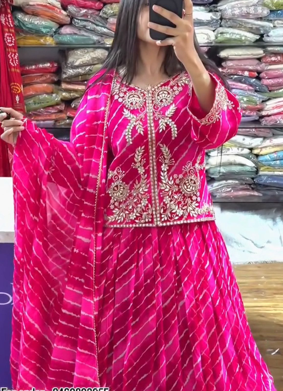 Close up view of heavy embroidery thread work and shimmering sequence detailing on dark pink georgette jacket bodice - WishTown Fashion Club